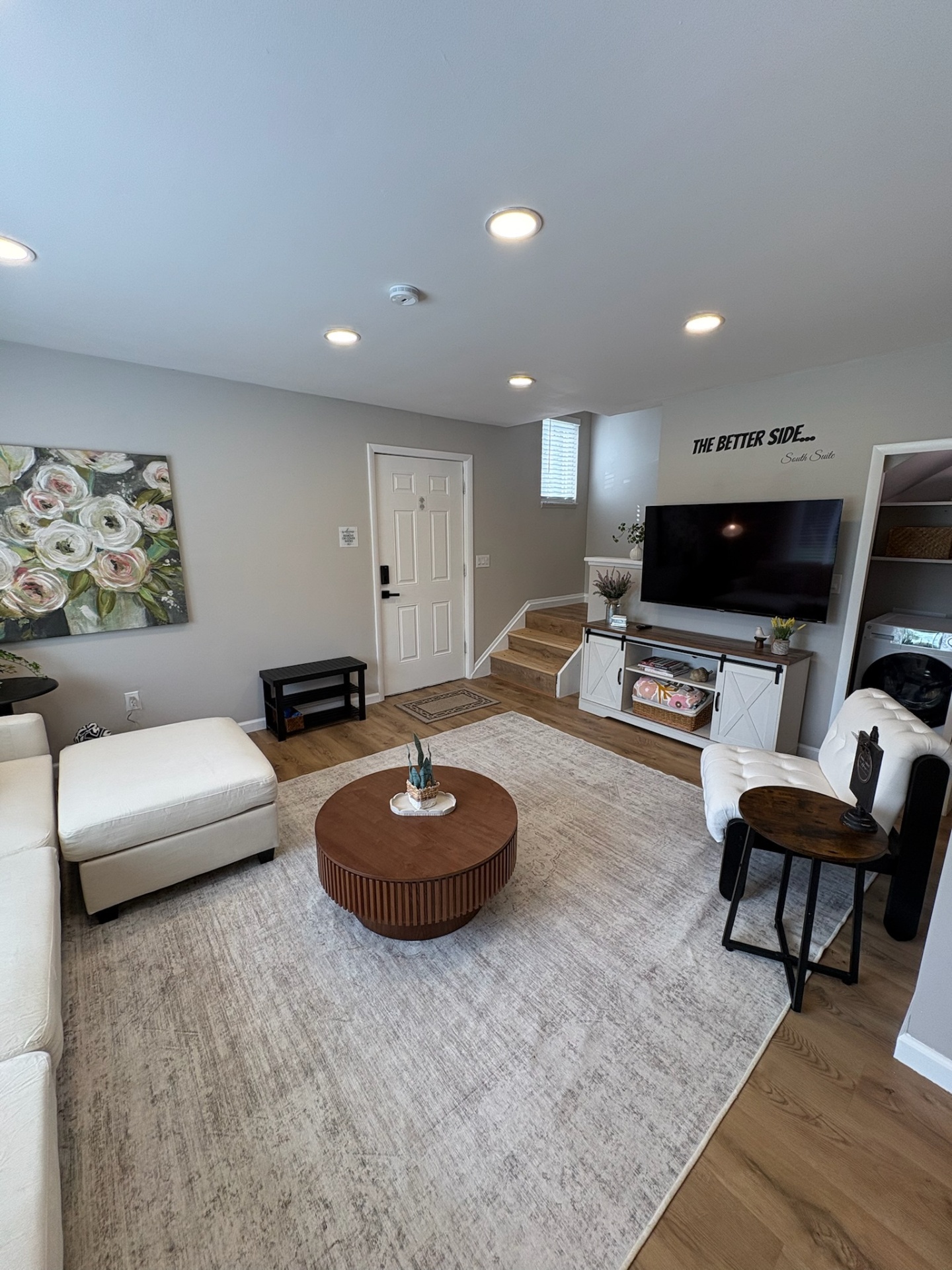 Living room with TV and entryway