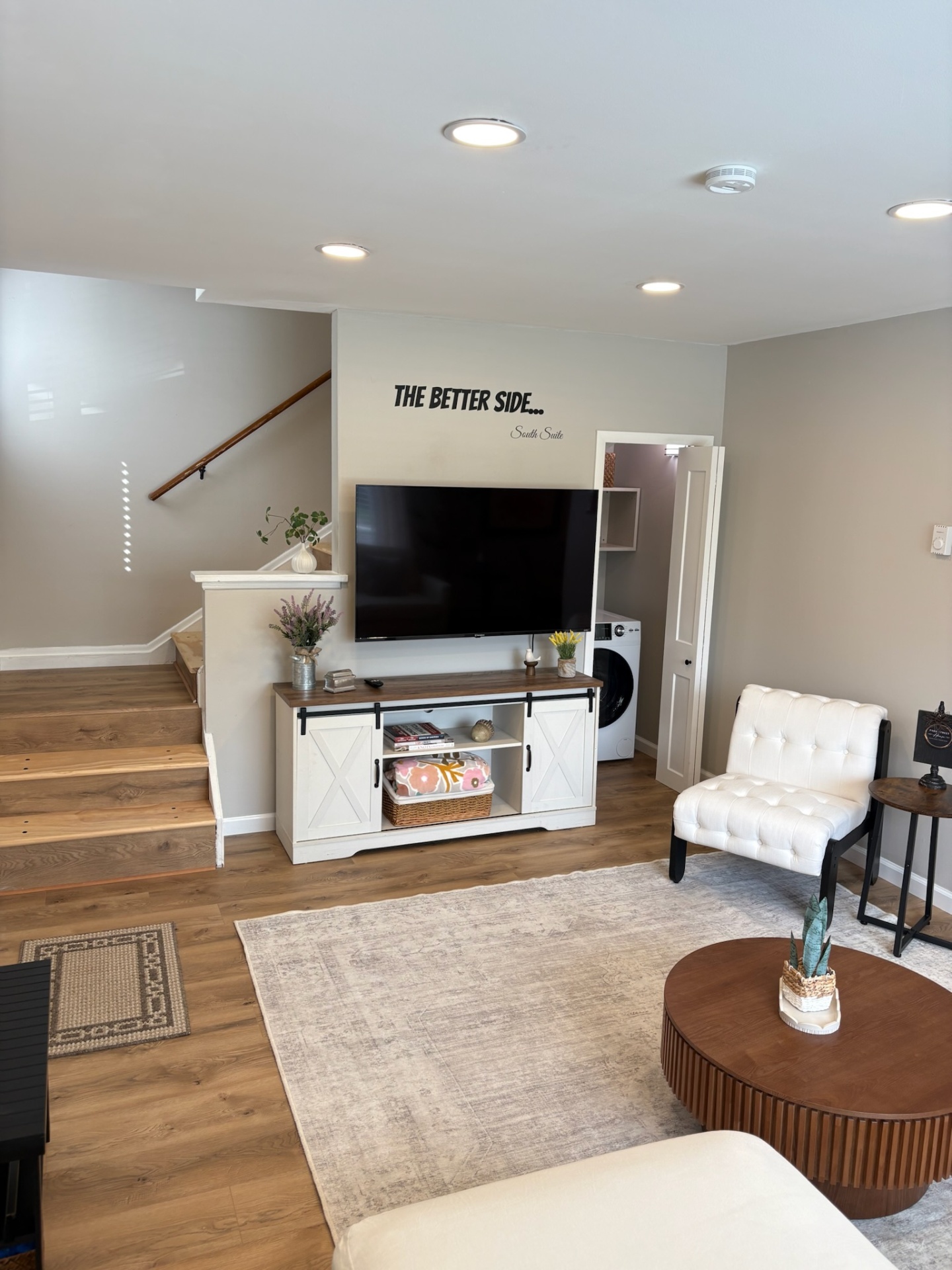Living room TV wall and laundry nook
