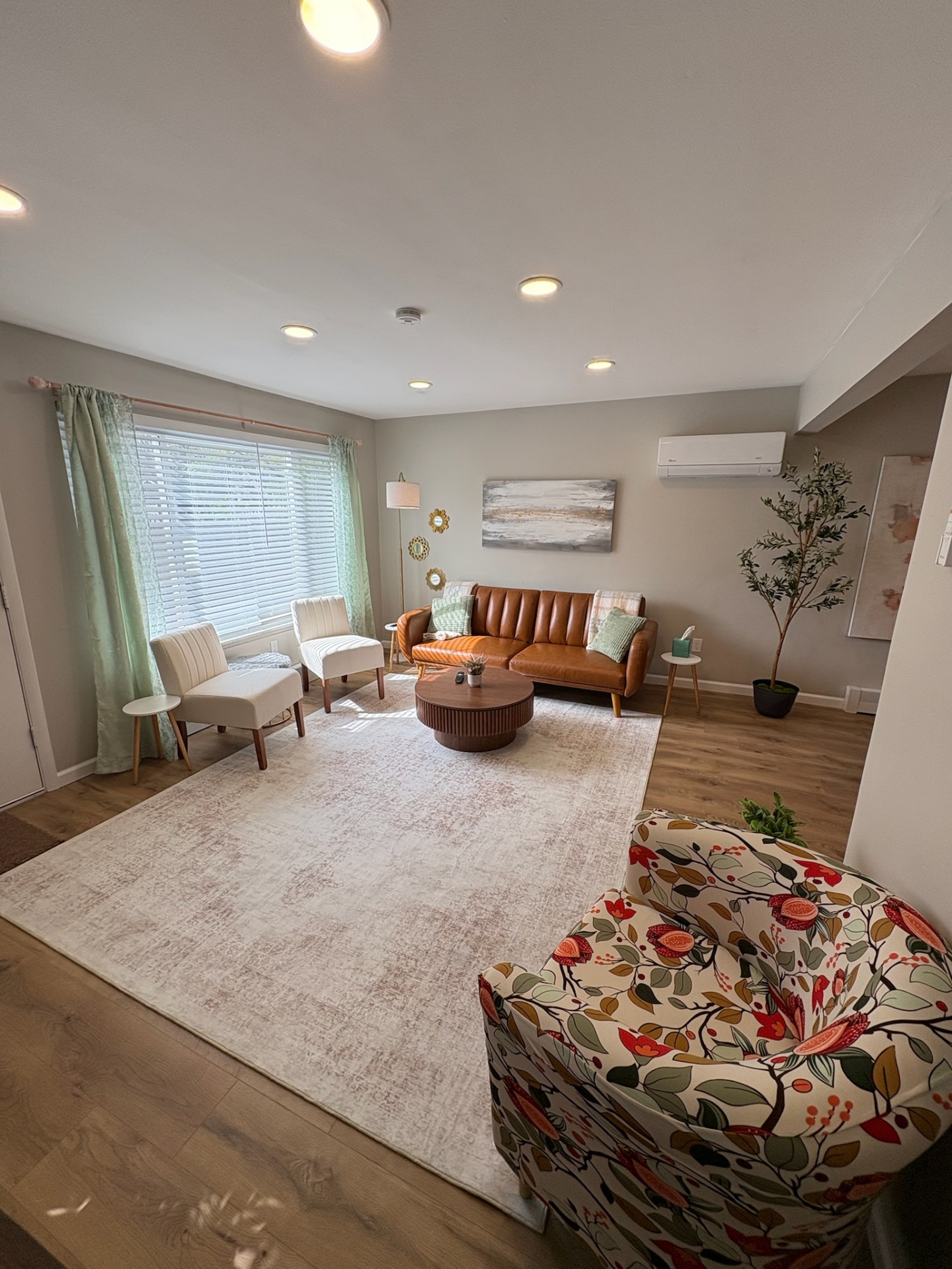 Living room with floral chair and natural light
