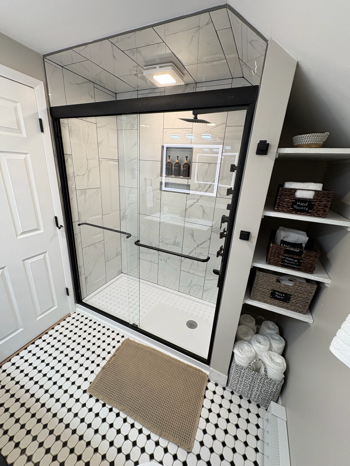 Walk-in marble shower with storage