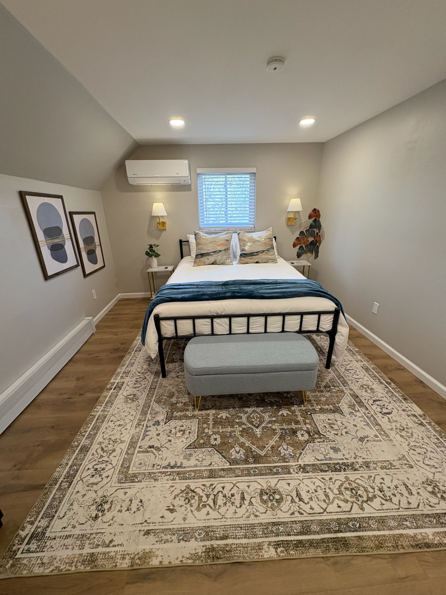 Primary bedroom view with art