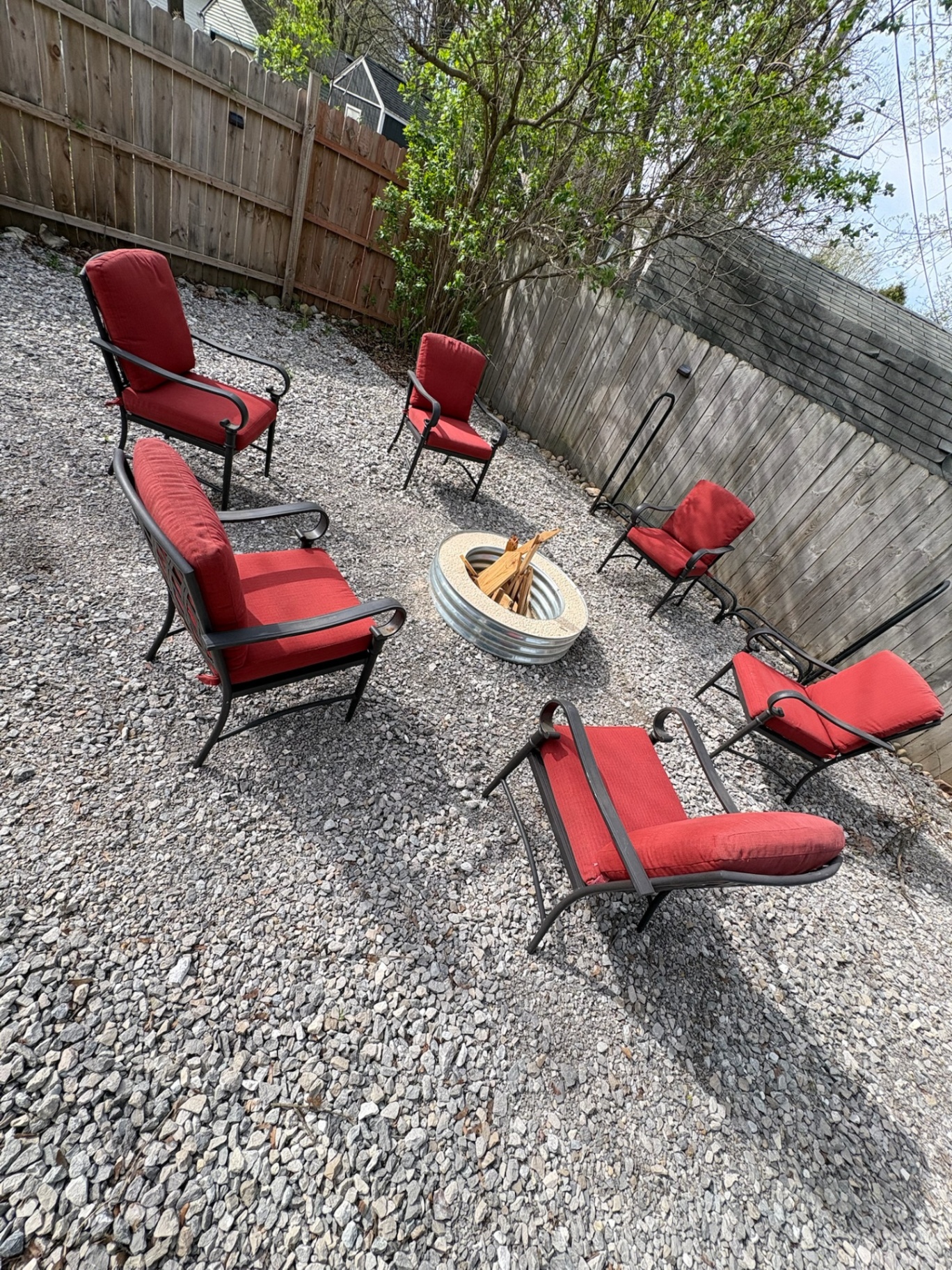 Outdoor firepit lounge with cushioned chairs